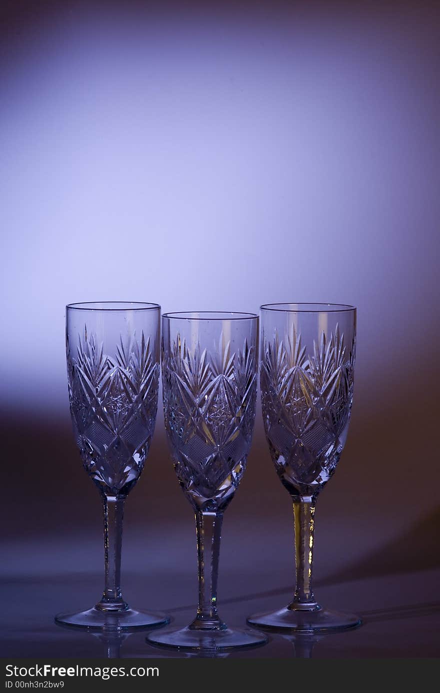 Luxurious glasses on a violt background