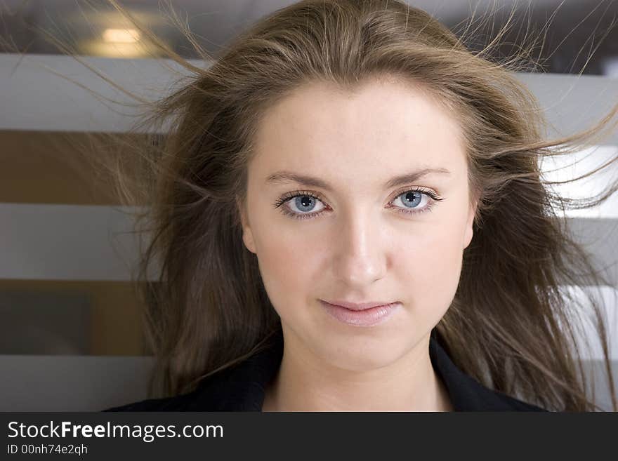 Portrait of a friendly professional woman looking nicely at the camera. Portrait of a friendly professional woman looking nicely at the camera.