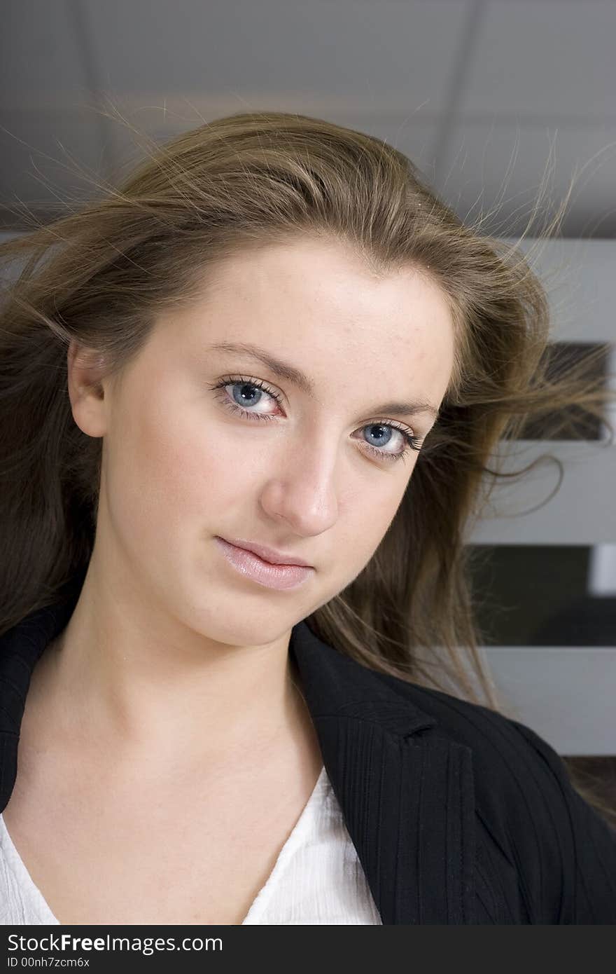 Portrait of a friendly professional woman looking nicely at the camera. Portrait of a friendly professional woman looking nicely at the camera.