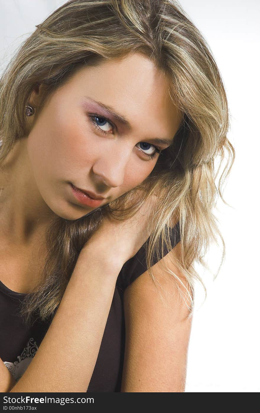 Portrait of the beautiful girl on a white background