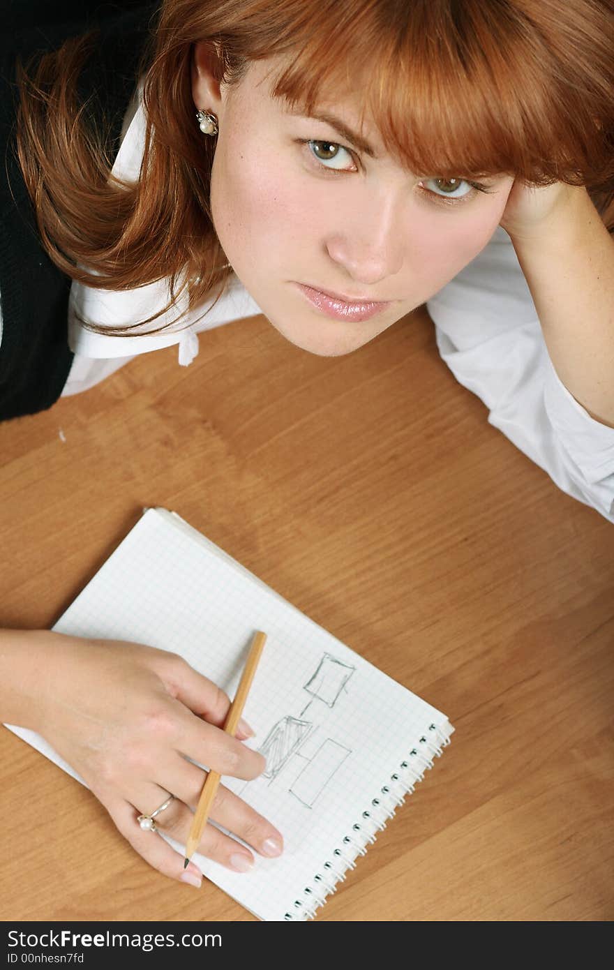 A woman looks tired, stress in office