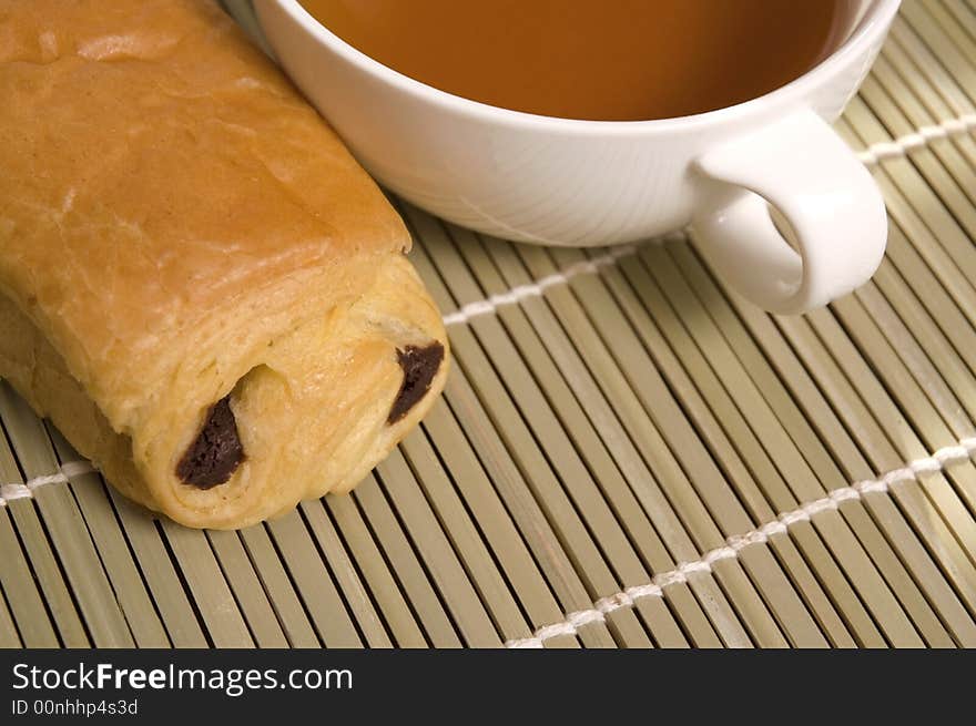 Breakfast tea and sweet cookie with chocolate