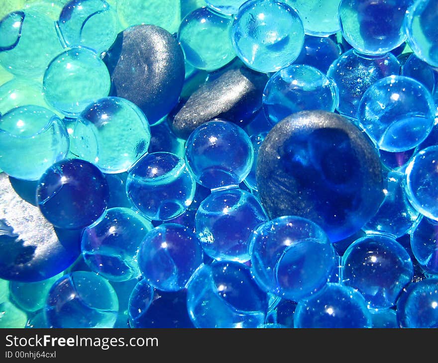 Blue Gems and Bubbles floating over water. Blue Gems and Bubbles floating over water