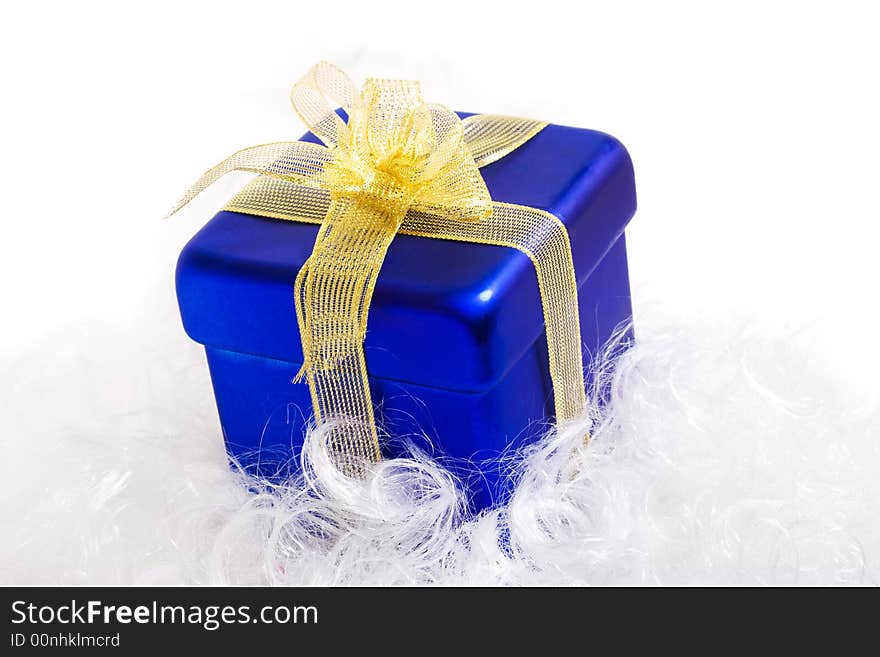 Blue box with yellow bow, with gift, low DOF. Blue box with yellow bow, with gift, low DOF