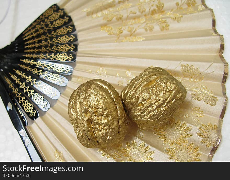 Two Walnuts On A Fan