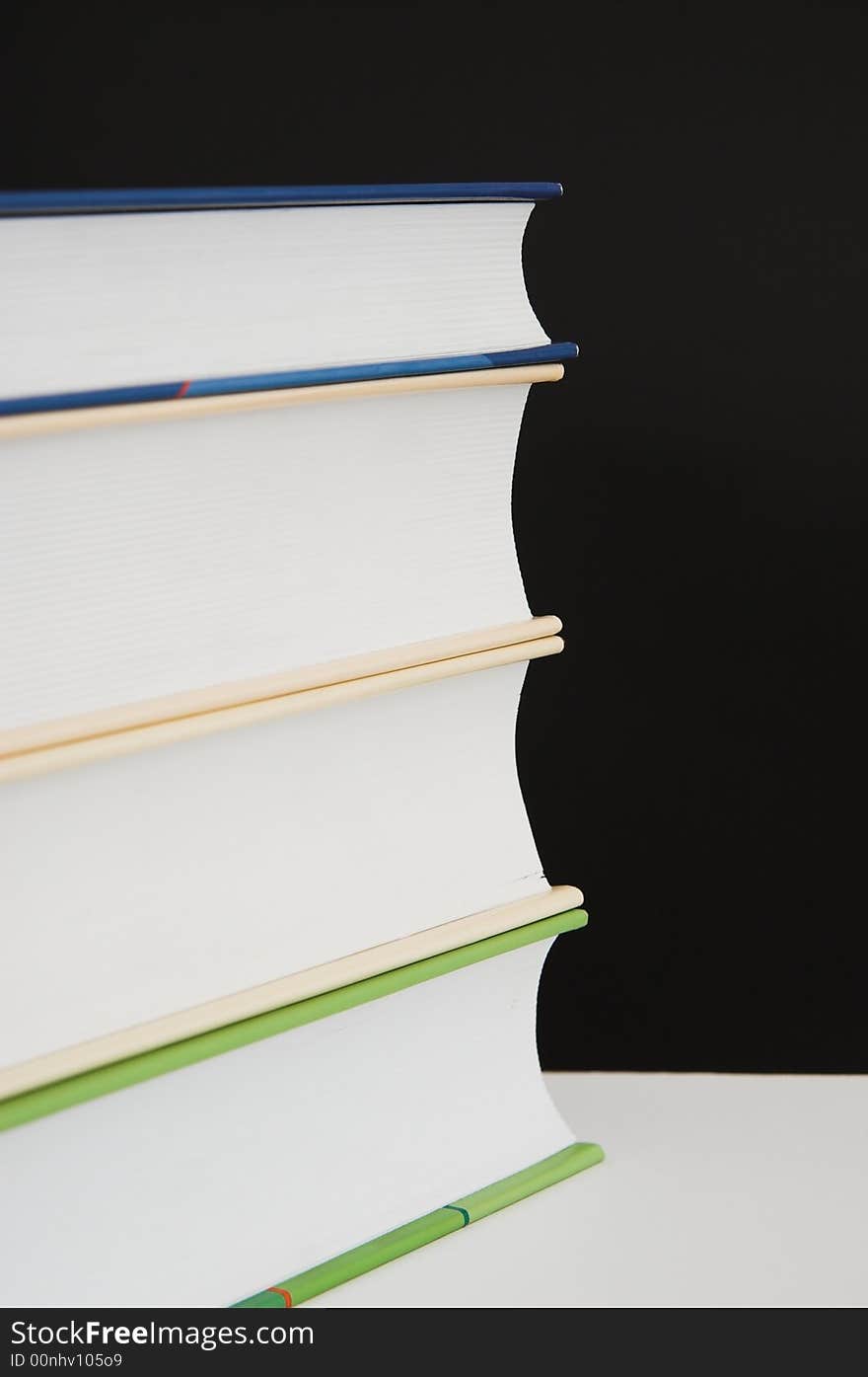 Stack of books - isolated over black background