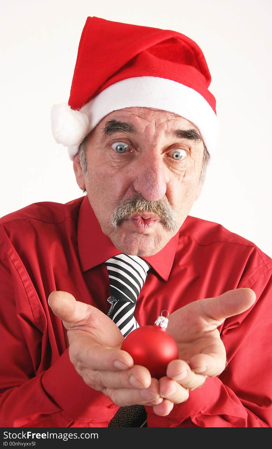 Man with santas's hat with christmas ornament on white background. Man with santas's hat with christmas ornament on white background