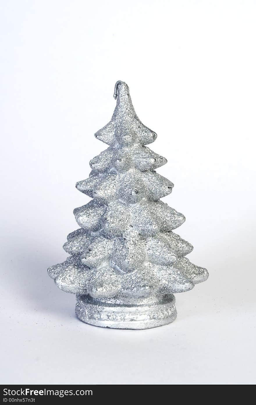 Small wax christmas silver tree isolated on white