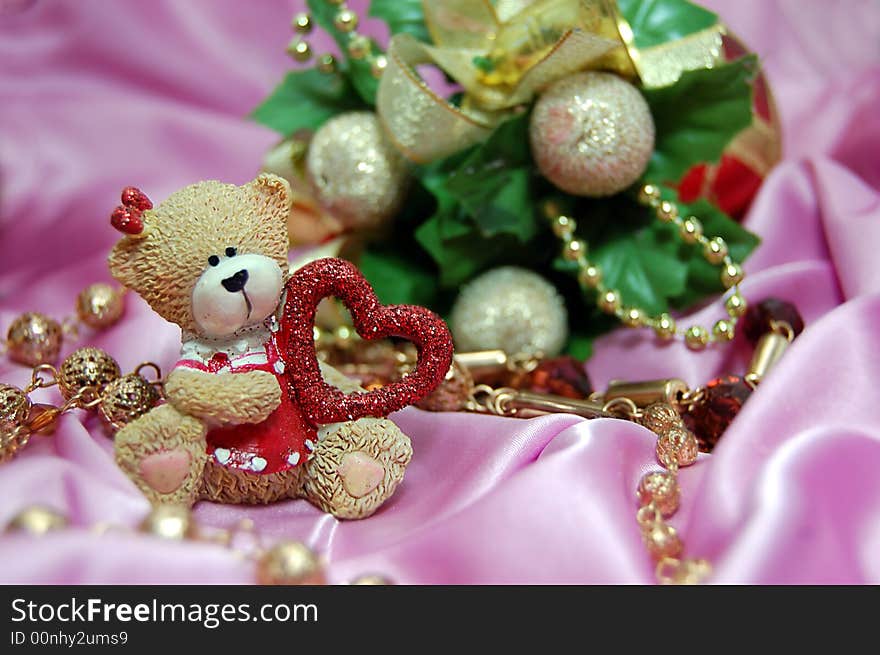 Bear figurine with red heart and Christmas decoration. Bear figurine with red heart and Christmas decoration