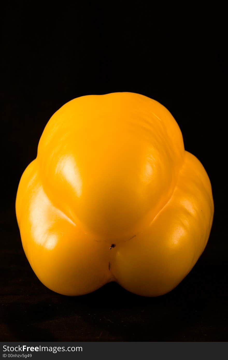 A yellow paprika photographed in a soft box. A yellow paprika photographed in a soft box.