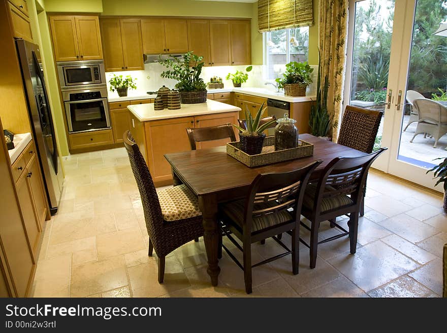 Luxury kitchen with table and island. Luxury kitchen with table and island.