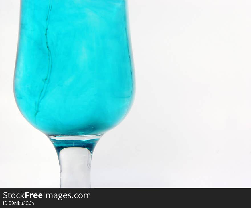 Close-up abstract fragment of glass with blue water with white background