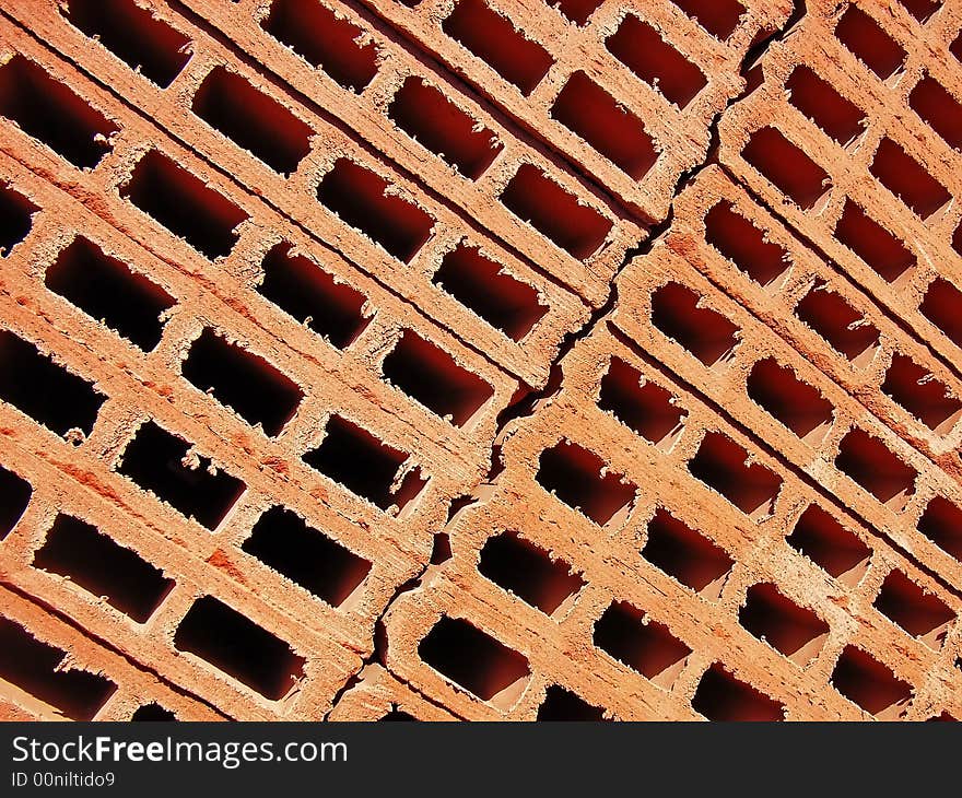 Red clay bricks stacked in a construction site. Red clay bricks stacked in a construction site