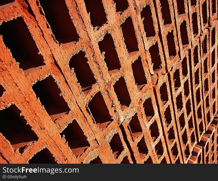 Detail of the holes of stacked red bricks. Detail of the holes of stacked red bricks