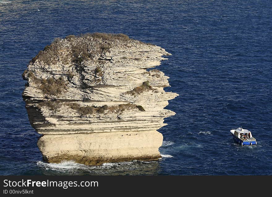 Le grain de sable is a rock in the Mediterranean
 at feet of Bonifacio's cliff, Corsica, France. Le grain de sable is a rock in the Mediterranean
 at feet of Bonifacio's cliff, Corsica, France