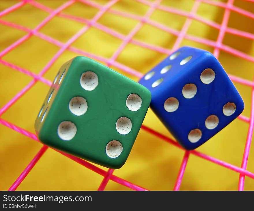 Green and blue dice used in board games