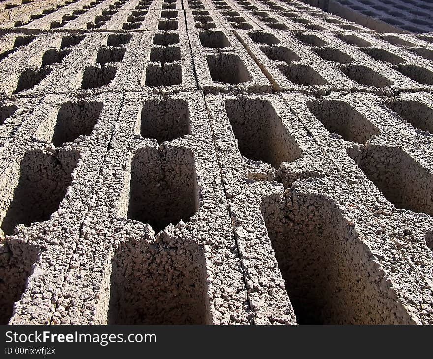 Rows of bricks stacked in a construction site