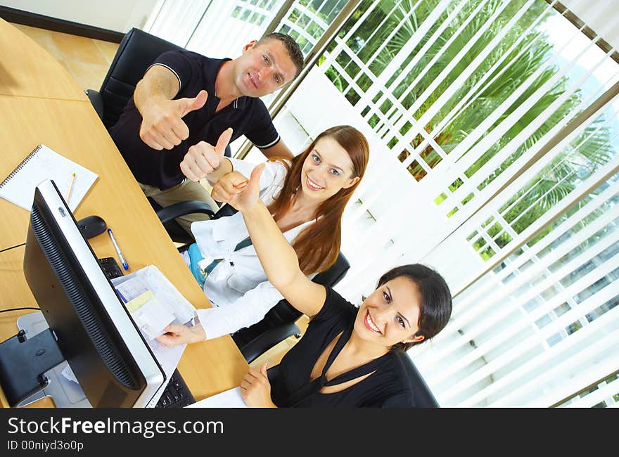 View of workgroup posing in a natural work environment. View of workgroup posing in a natural work environment