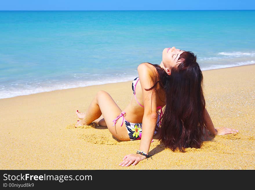 View of a young gorgeous female in summer environment. View of a young gorgeous female in summer environment