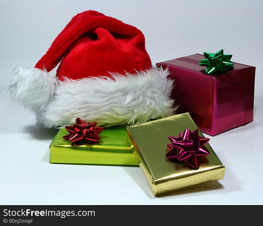 Gift with santa's hat on white background. Gift with santa's hat on white background