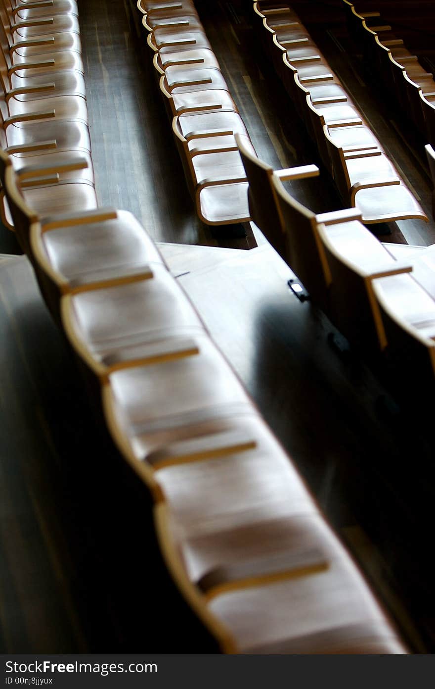 A theatre of wooden chairs. A theatre of wooden chairs