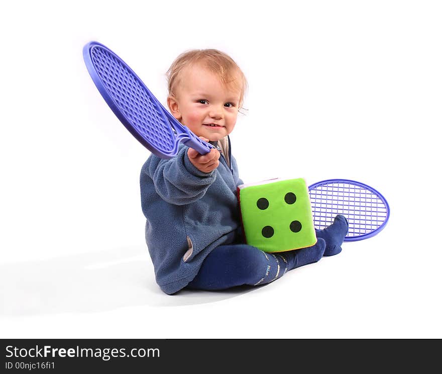 First lesson of tennis - boy on white