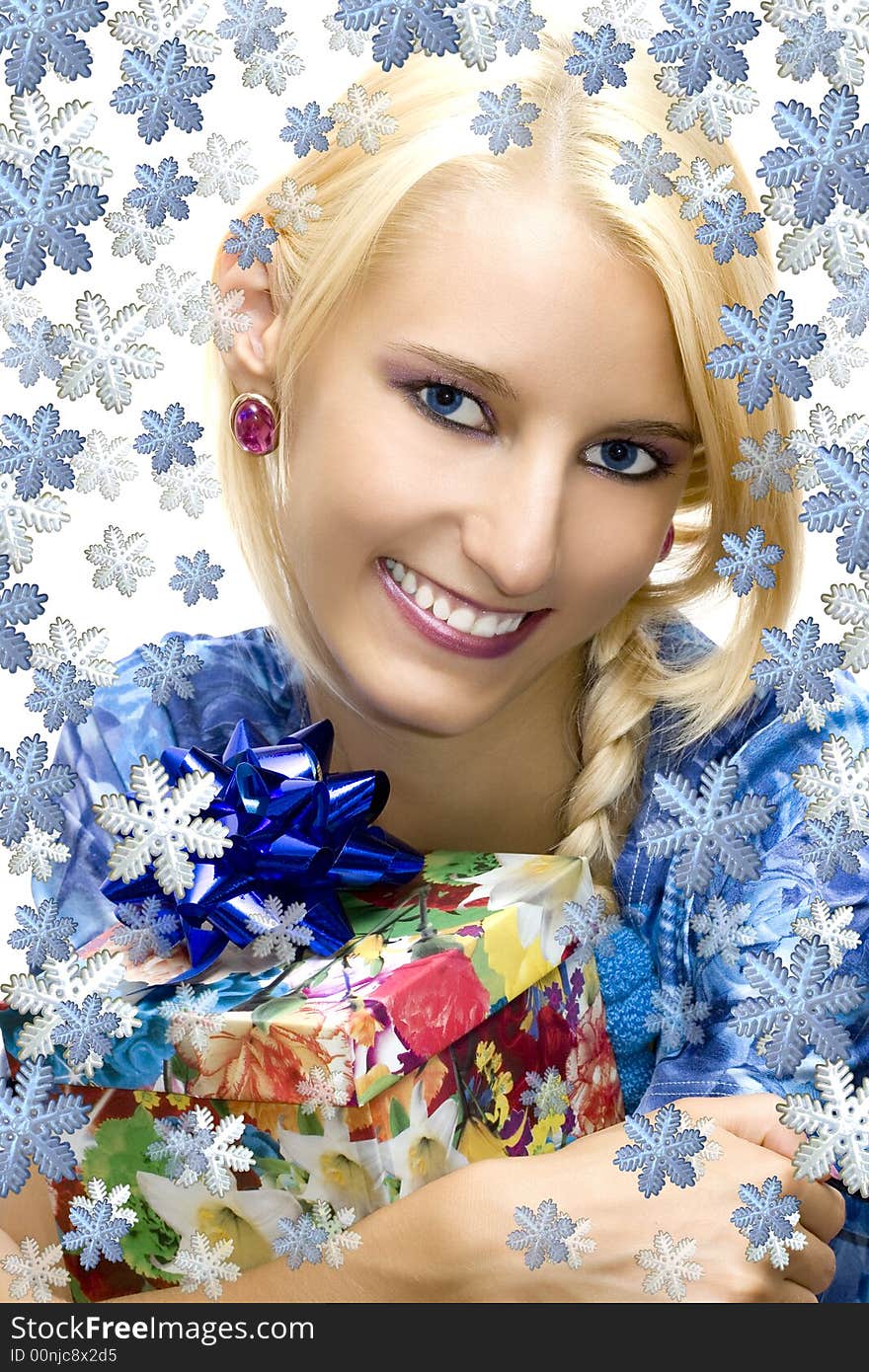 Attractive girl with present box and snowflakes