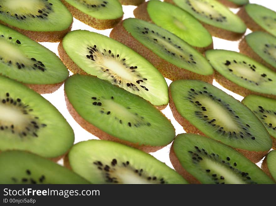 Slices of fresh kiwi background. Slices of fresh kiwi background