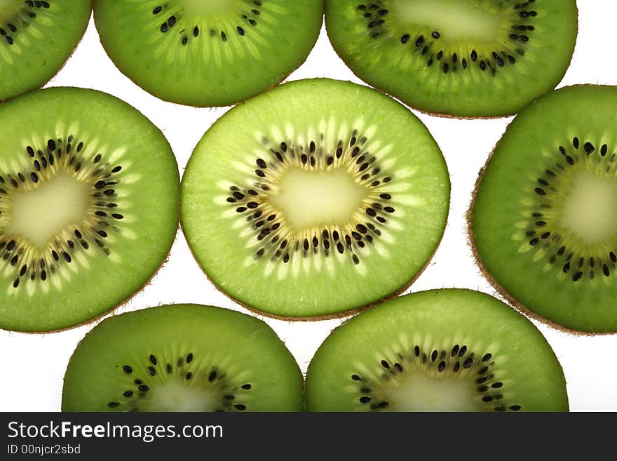 Slices of fresh kiwi background. Slices of fresh kiwi background