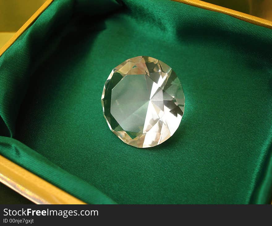 Beautiful diamond crystal on green box