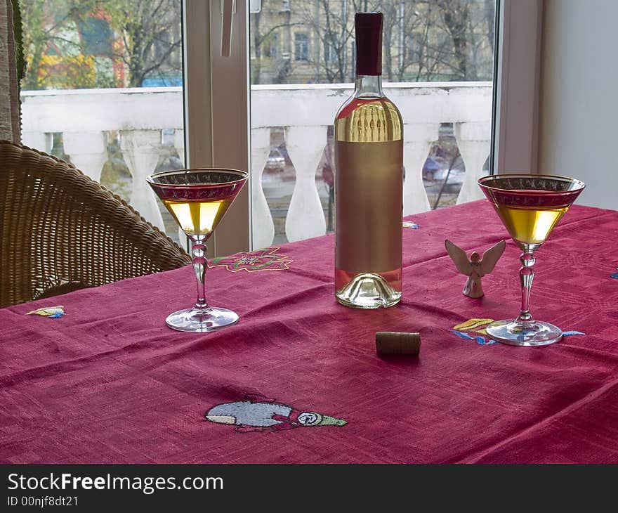 Interior with christmass tablecloths and wine bottle