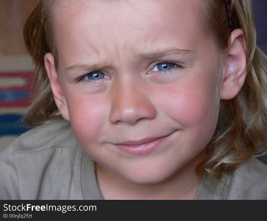 The portrait of a small blond boy. The portrait of a small blond boy