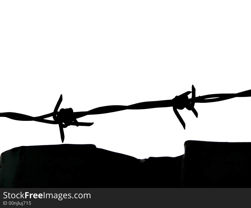 Portrait of barbed wire fence and wall