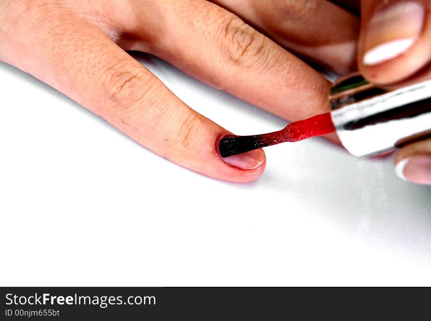 Doing french manicure with red nail polish. Doing french manicure with red nail polish