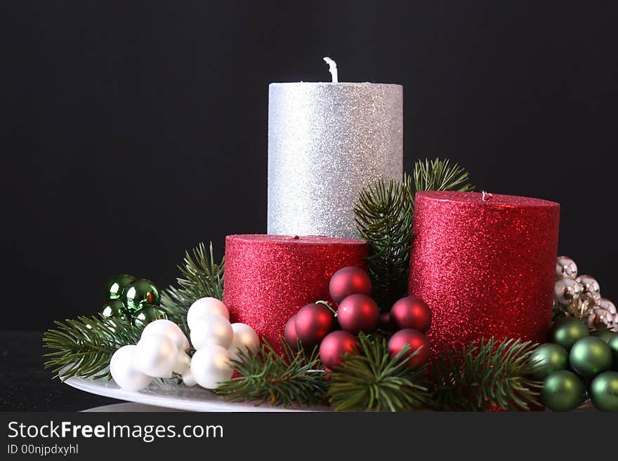 Tree candles in christmas decorated plate. Tree candles in christmas decorated plate