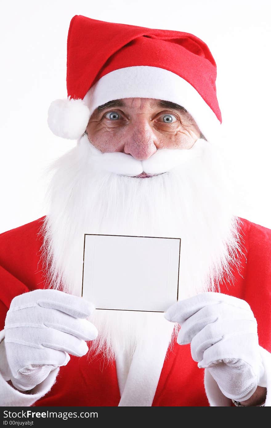 Santa holding a small blank white card. Santa holding a small blank white card