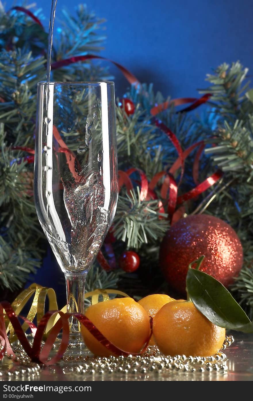 Still life with glass with champagne on the blue background