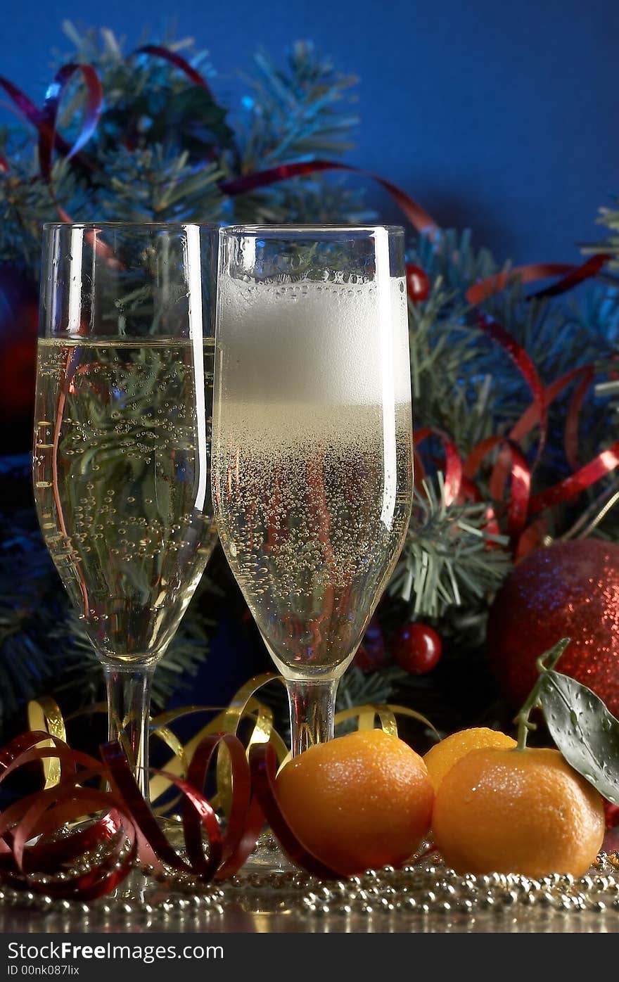 Still life with glass with champagne on the blue background