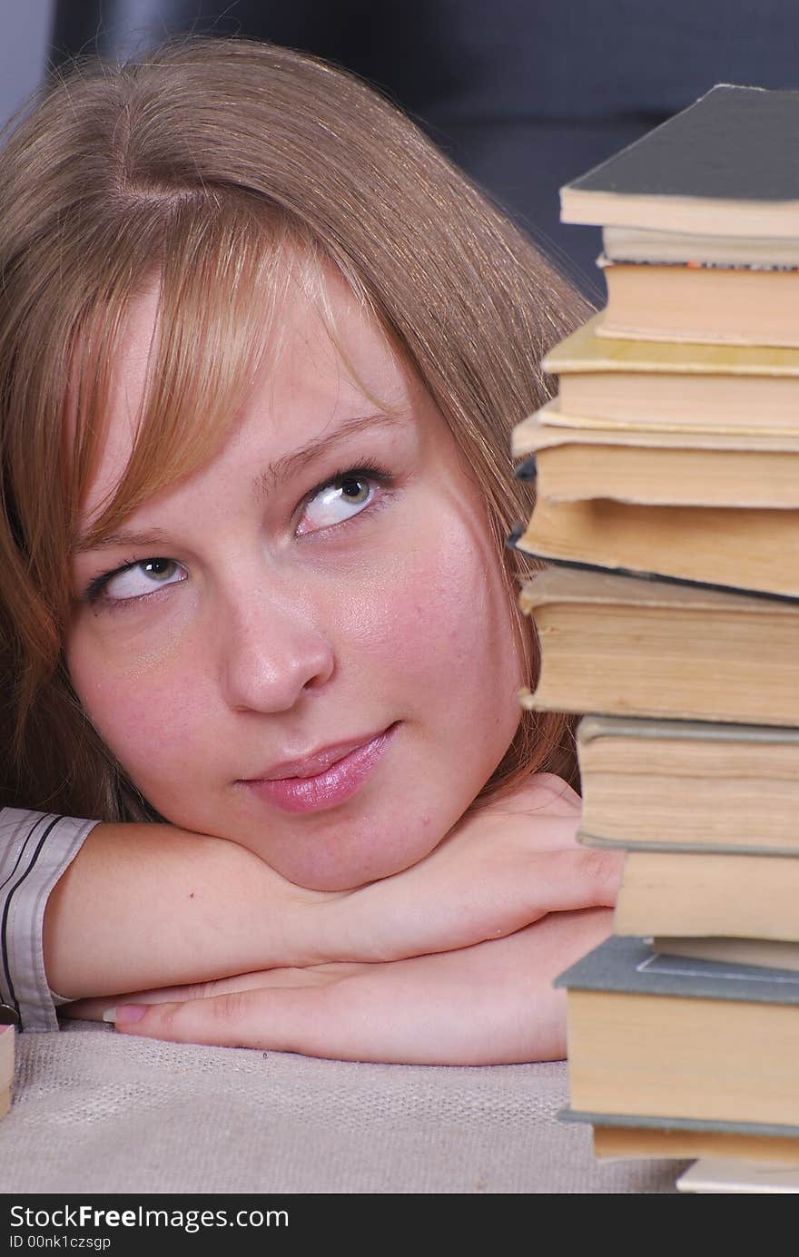 Thoughtful studentgirl with a book. Thoughtful studentgirl with a book