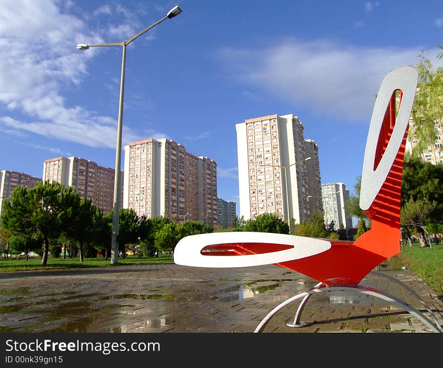 Apartment building and bench