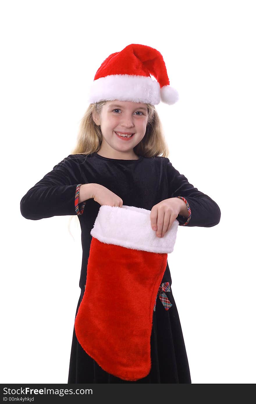 Photo of a child with santa hat & stocking