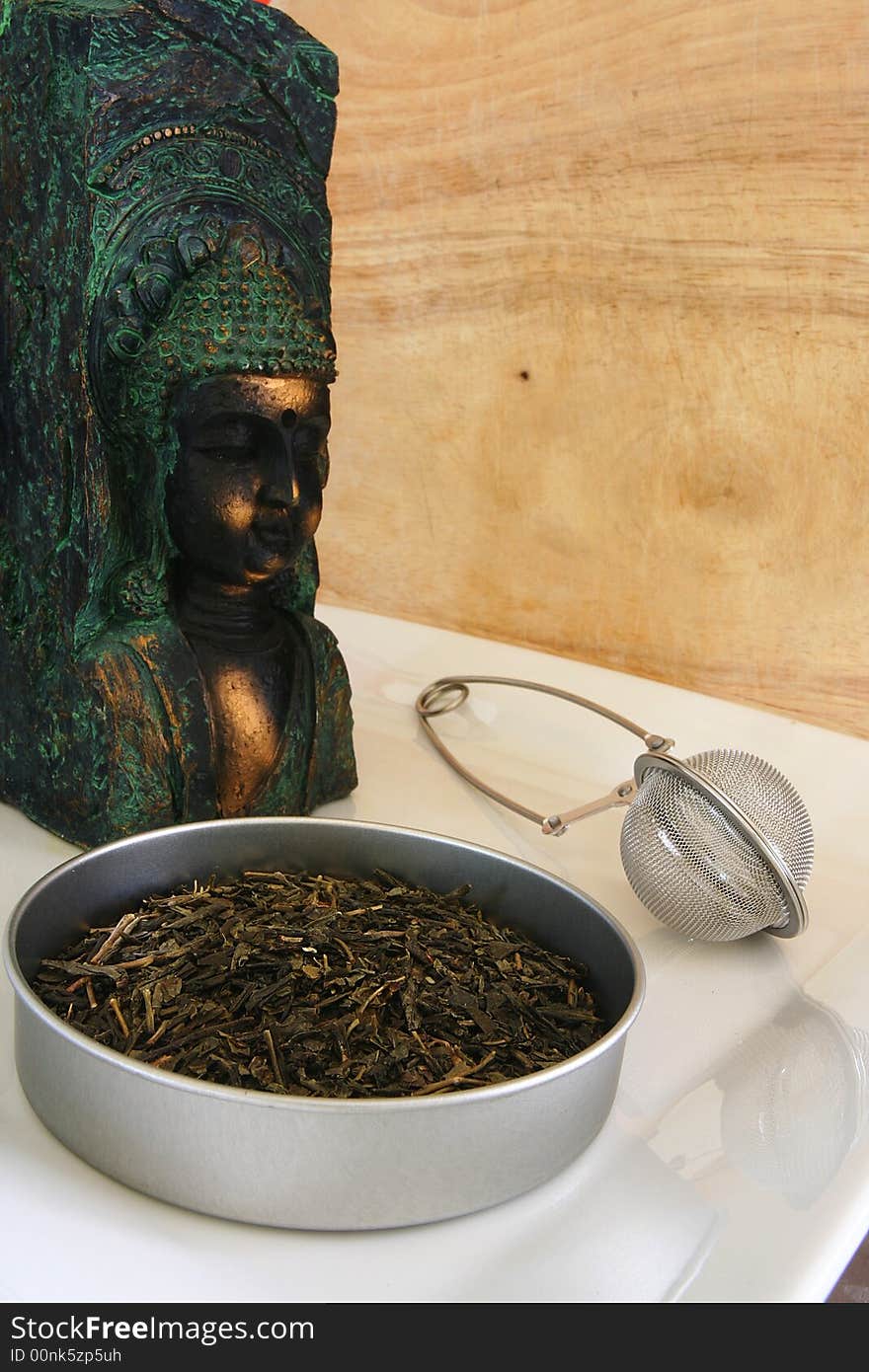 Tea leaves with buddha satue. Tea leaves with buddha satue