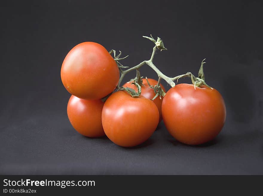 The tomatoes isolated on black