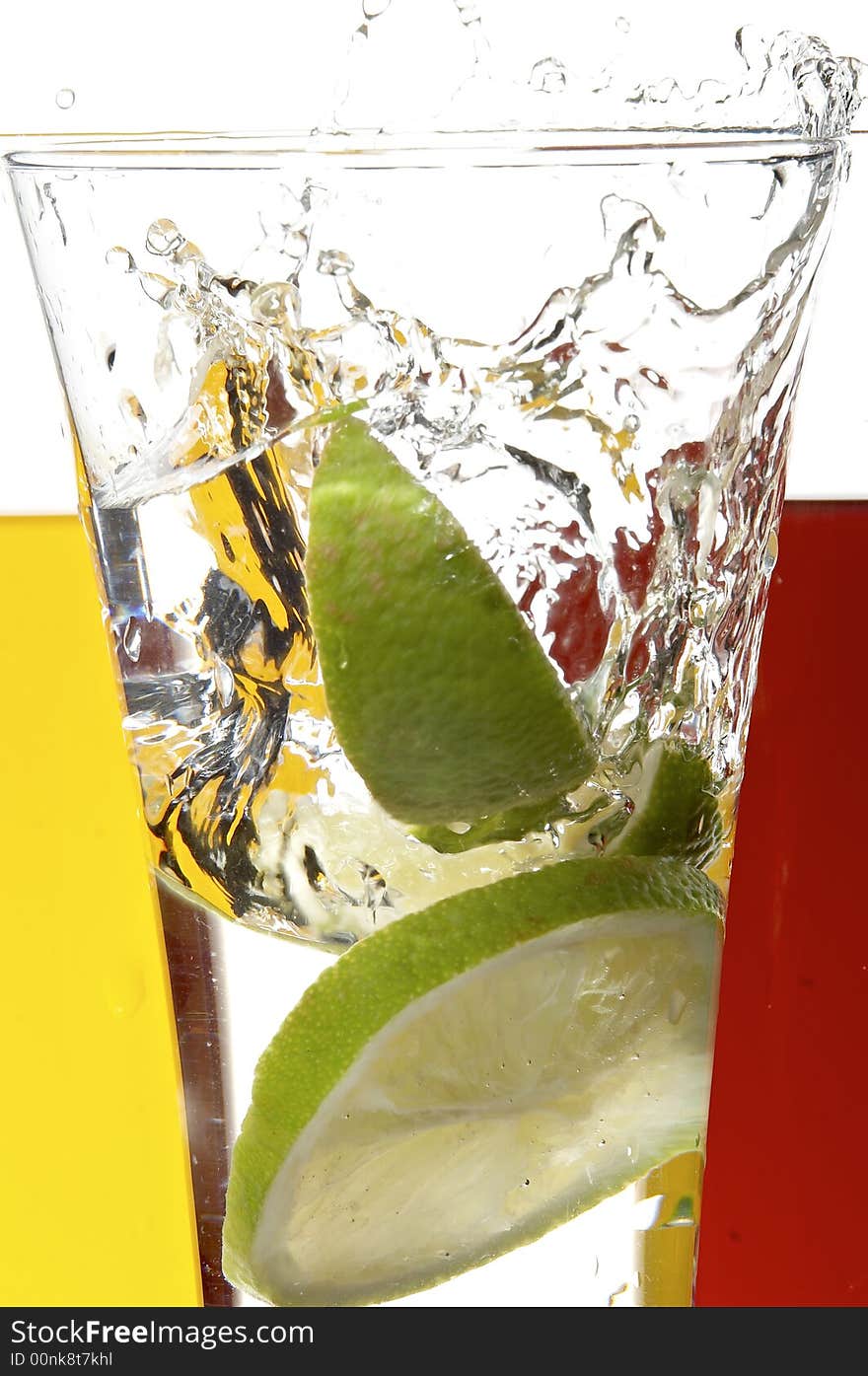 Glass with juice and lemon on the white background