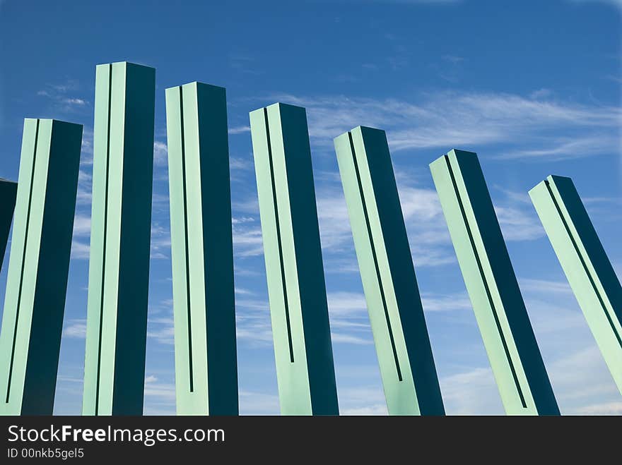 Picture of an abstract pillar like structures against a blue sky. Picture of an abstract pillar like structures against a blue sky