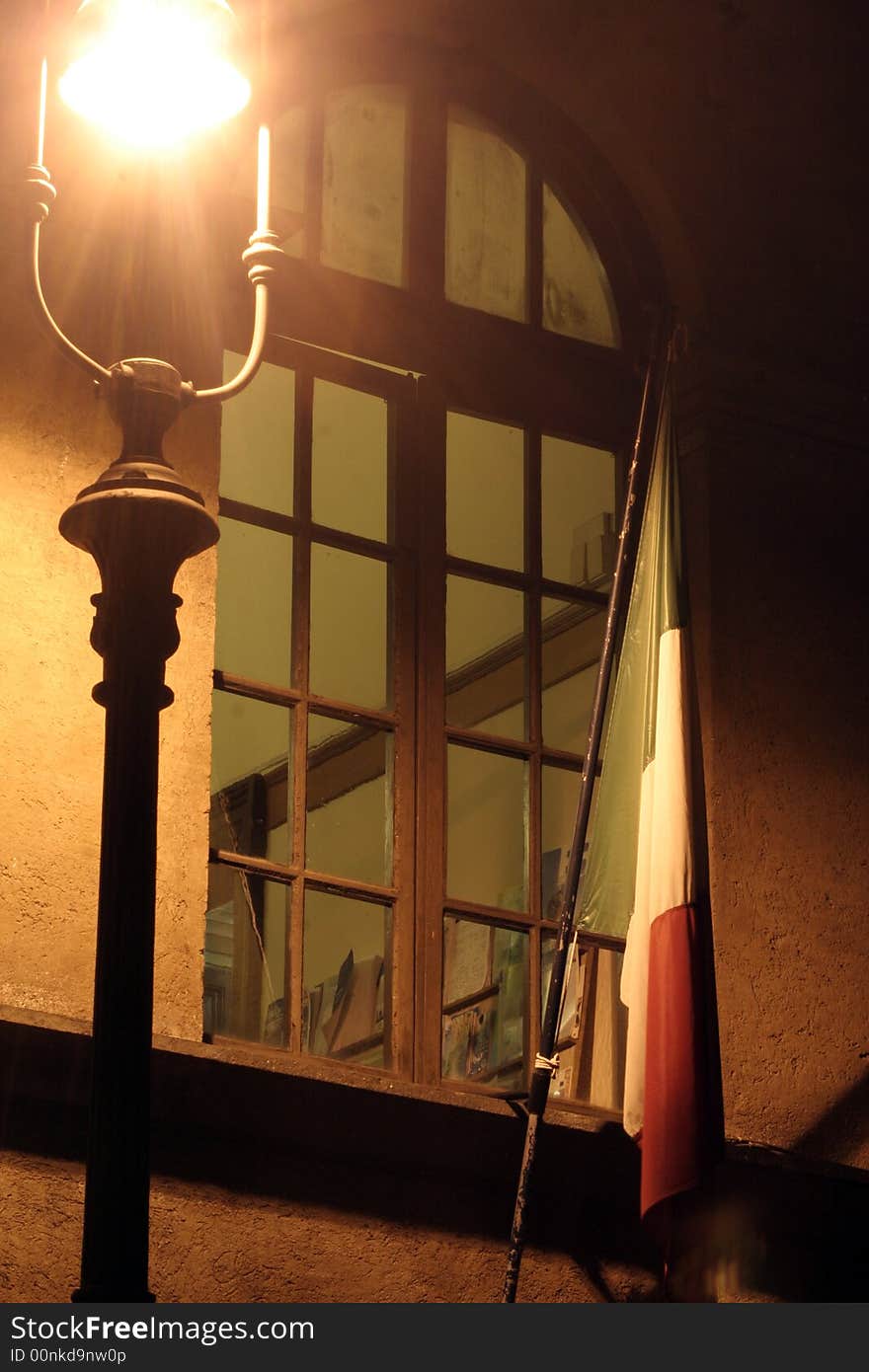 Window with lamppost and Italian flag - Night - Rome Italy Europe. Window with lamppost and Italian flag - Night - Rome Italy Europe