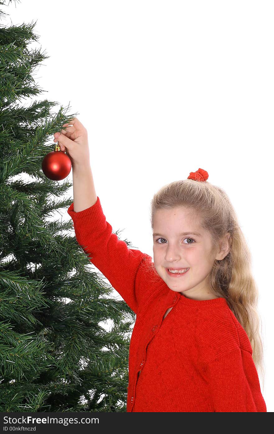 Photo of a Child hanging ornament smile copyspace