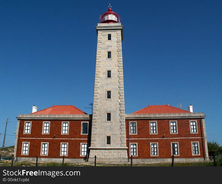 Photo of lighthouse and is adjacent buildings