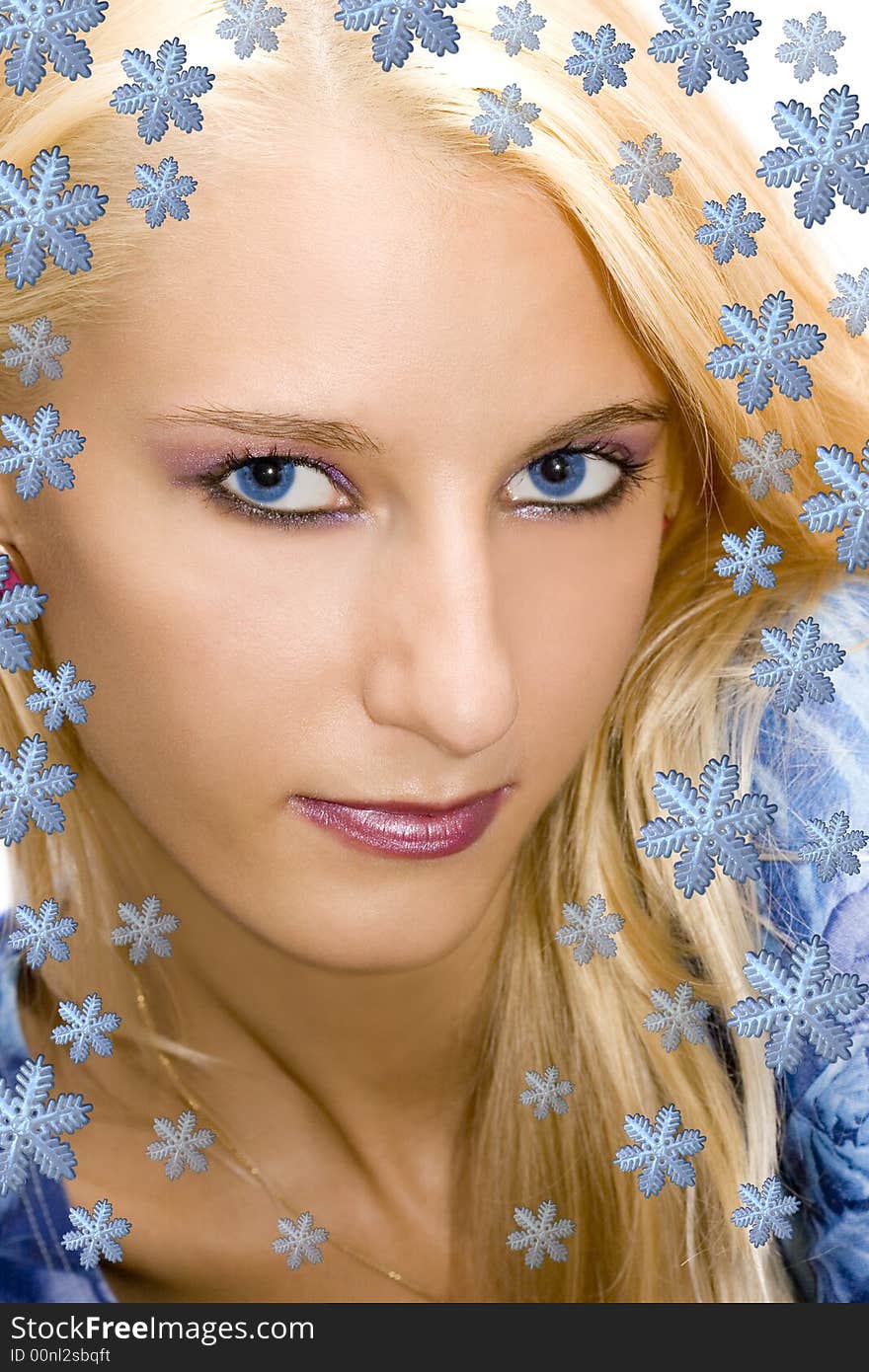 Beautiful blond girl with snowflakes