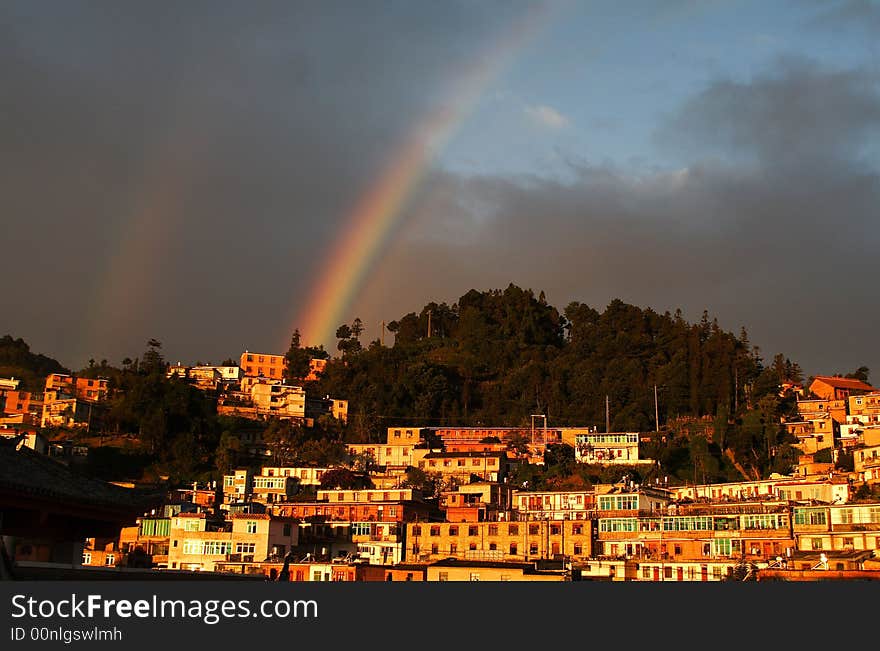 Twin rainbow over highland town